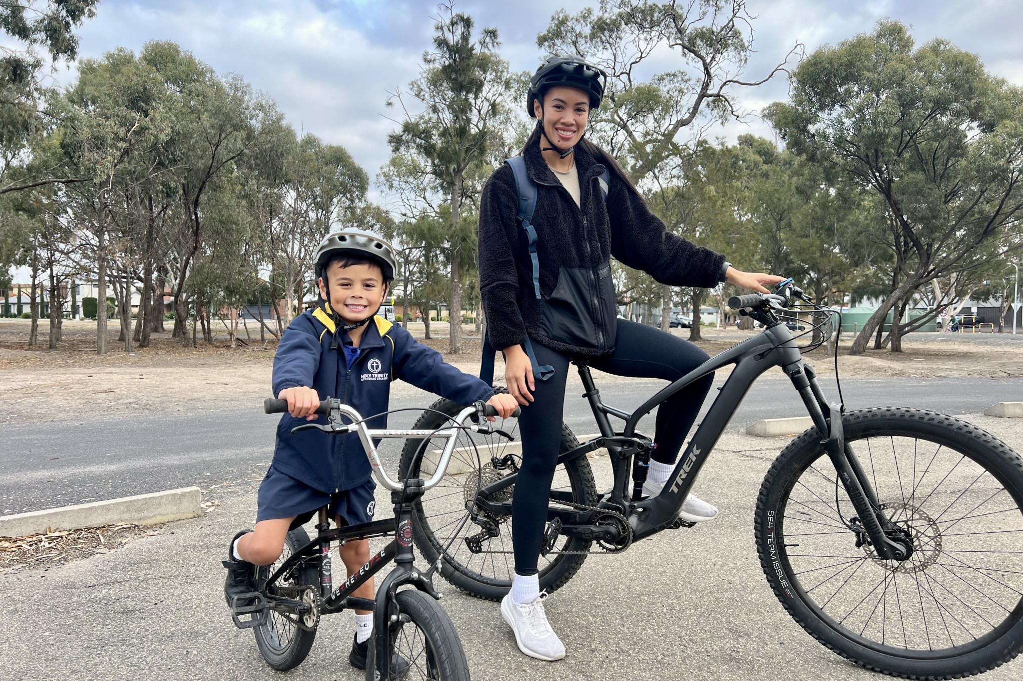 Knox, 5, with his mum Erika Reinhard, before riding to school with other schoolmates. Photo: TAYYAAB MASROOR