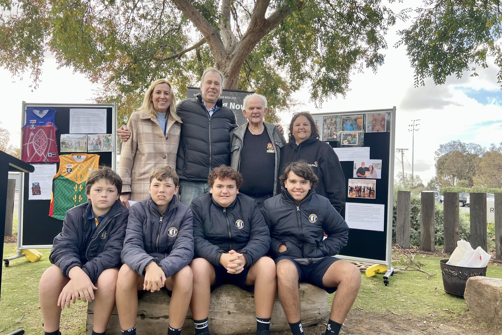 Horsham Rural City Council CEO Gail Gatt, Mayor Ian Ross, Uncle Ron Marks, and Pam Branson (back) with the kids Shayne, Xavier, Hunter, and Chace (front), who helped Uncle Ron during the smoking ceremony in recognition of the reconciliation event at the Meeting Place on Wednesday. Photo: TAYYAAB MASROOR