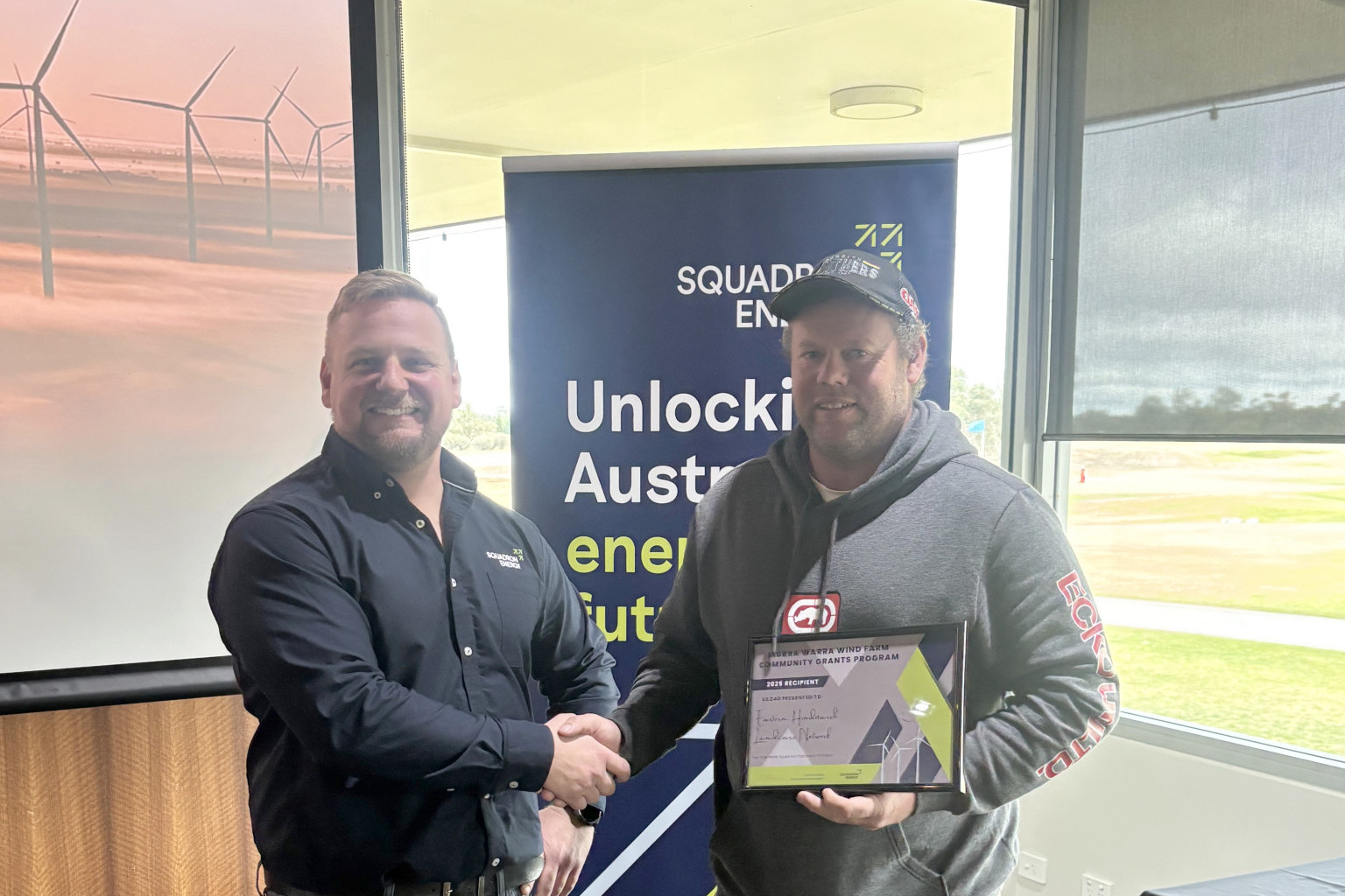 Daniel Paech, secretary of Eastern Hindmarsh Landcare Group, receiving his successful grant certificate from the representative of the Murra Warra Wind Farm.