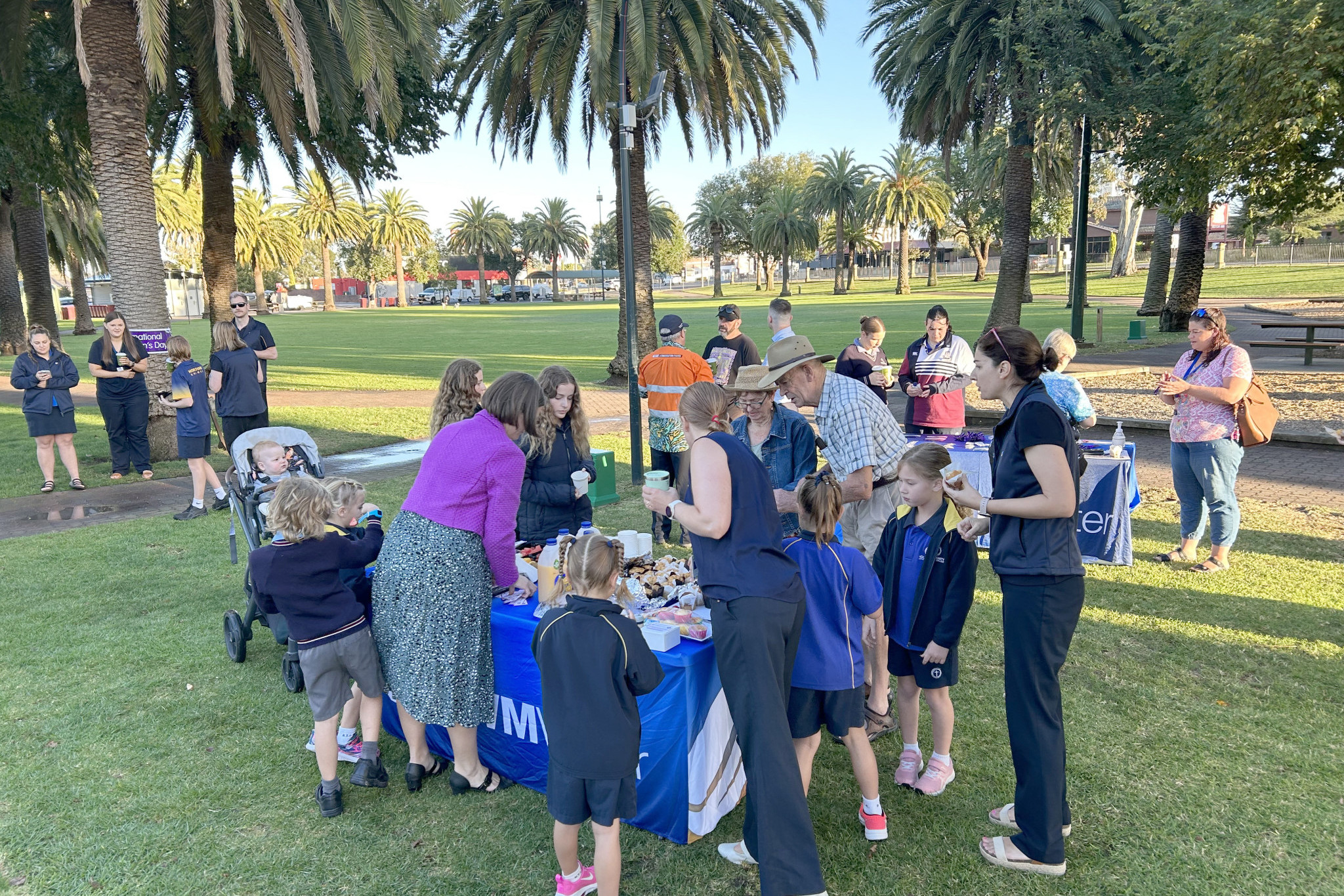Community members of all ages gather in May Park, Horsham, for GWMWater's International Women's Day event.