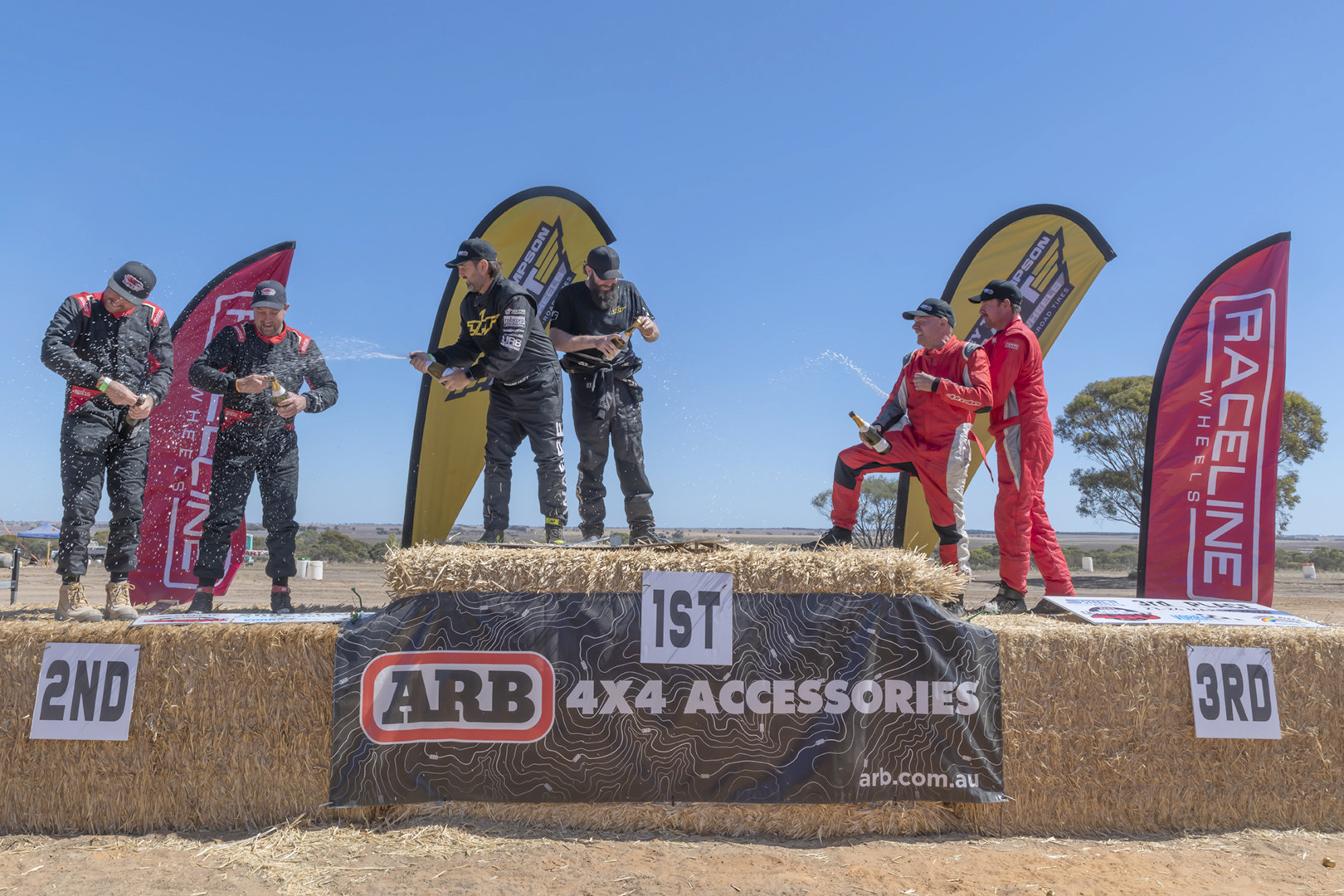 Beau Robinson and Shane Hutt in first place, Clayton Chapman and Adam McGuire in second, and Andrew Brown and Danny Hardman in third place celebrate the weekend at the podium PHOTO Shane Roberts