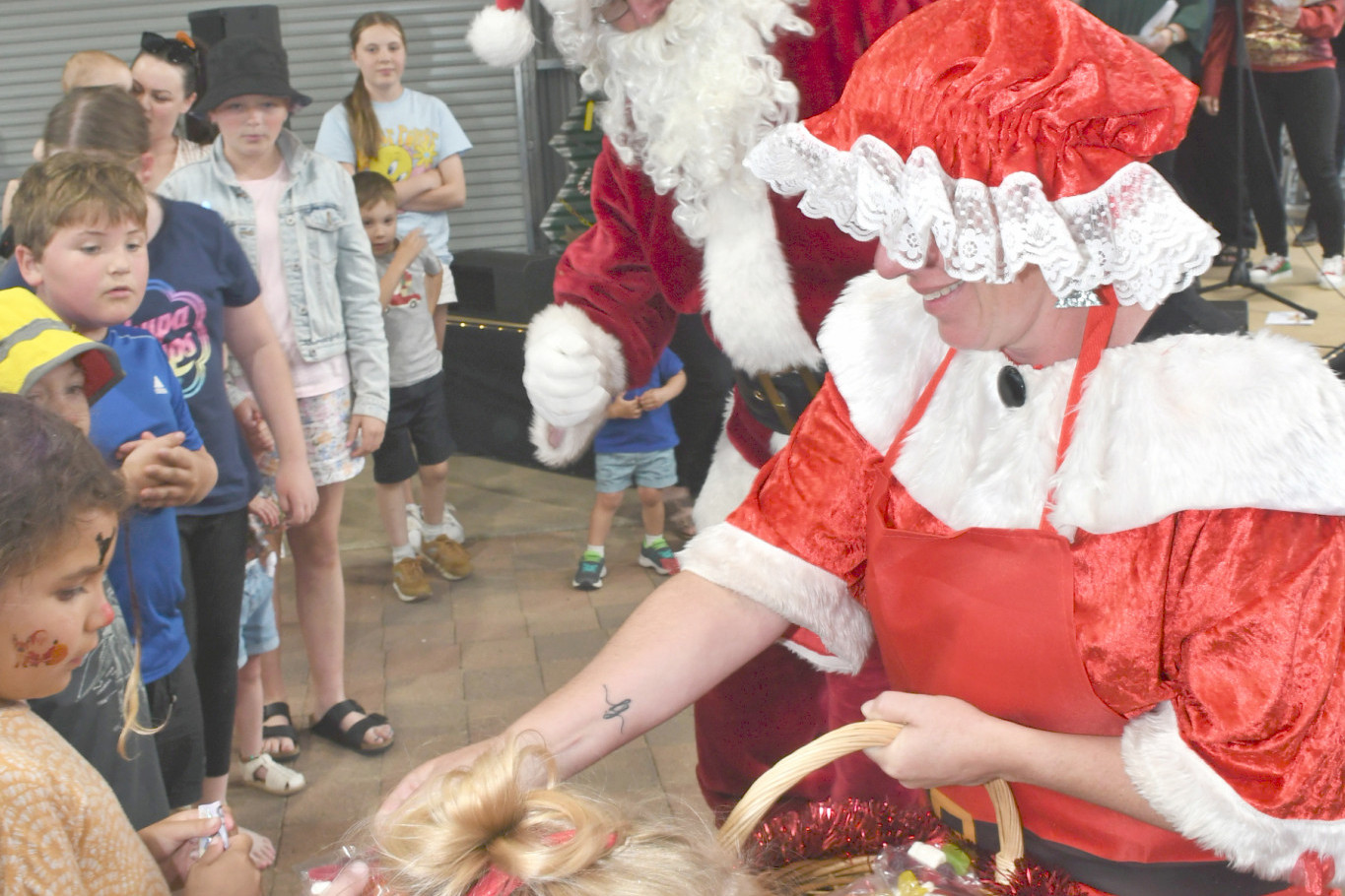 Mr and Mrs Claus hand out lollies at the Christmas Festival last year.