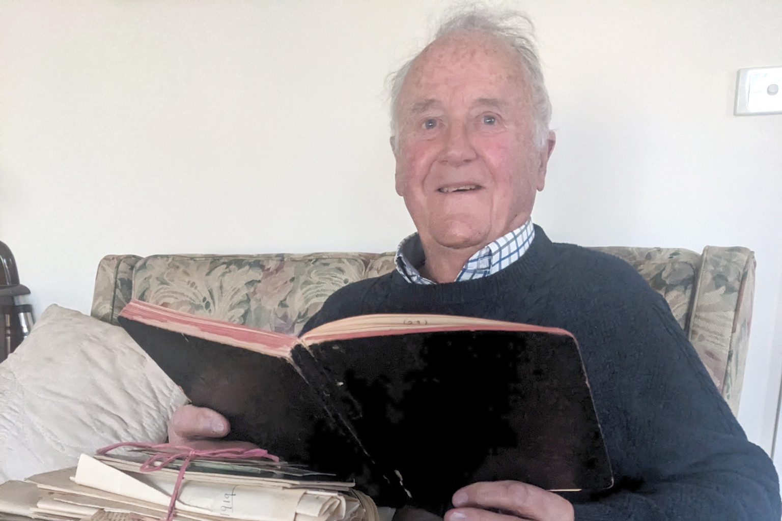 Roger Gabbe with a selection of his grandfather's journals. CREDIT - Faye Smith