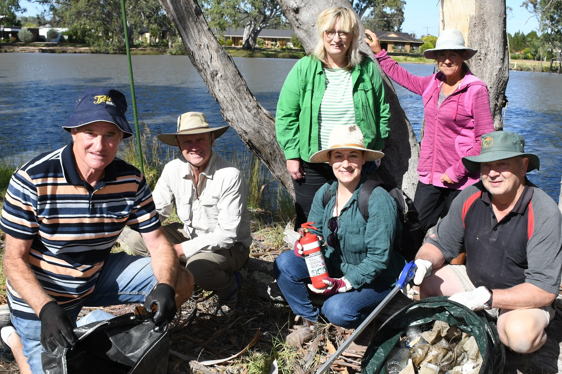 Yarrilinks coordinator Alicia Merriam, is surrounded by helpers Adrian Tyler, Fred Ackland, Lavegne Lehmann, Corrinnee Heinz and Mick Schilling at the bank of the creek.