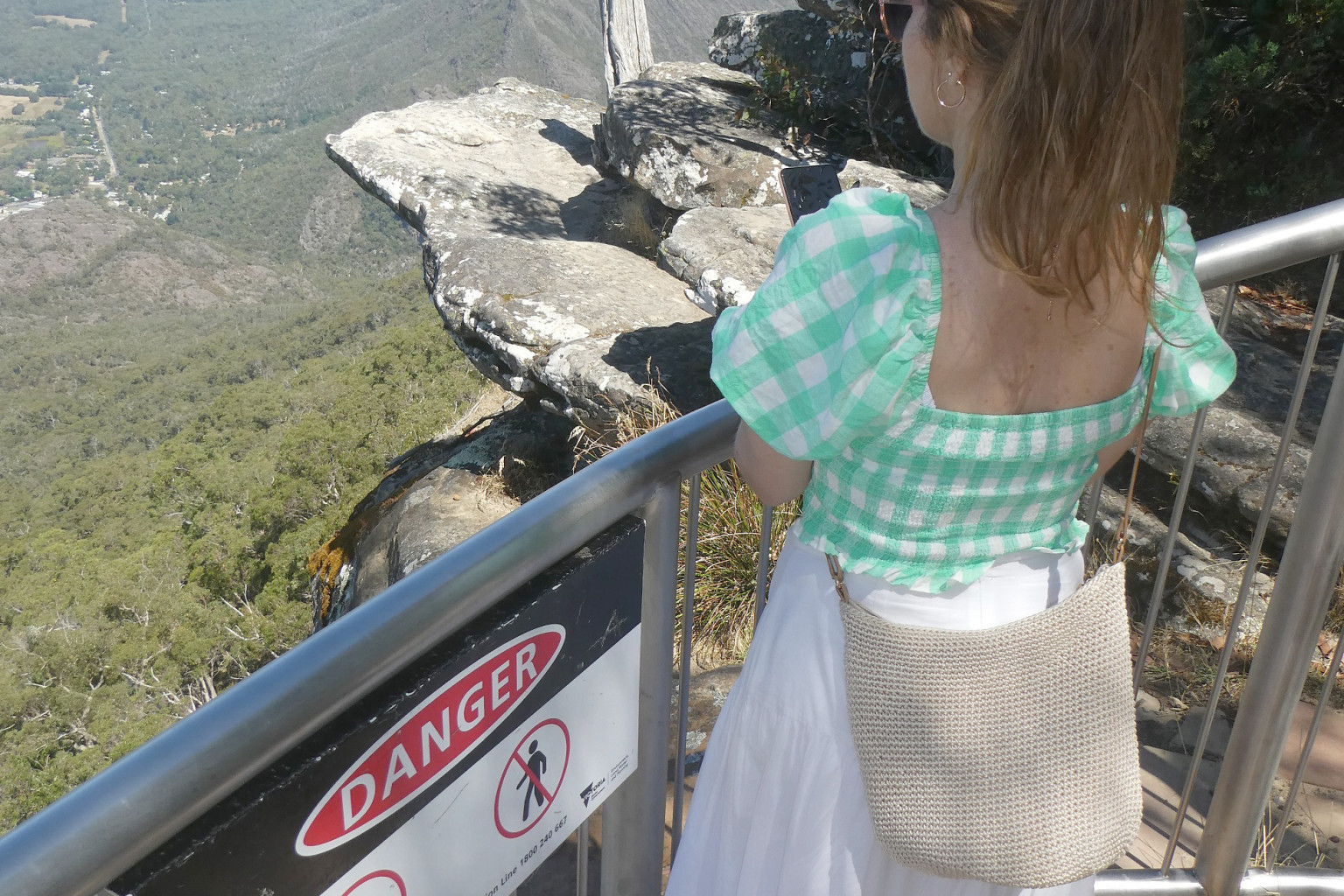 3 Warning signs are clearly evident on a safety barrier at the popular scenic spot.