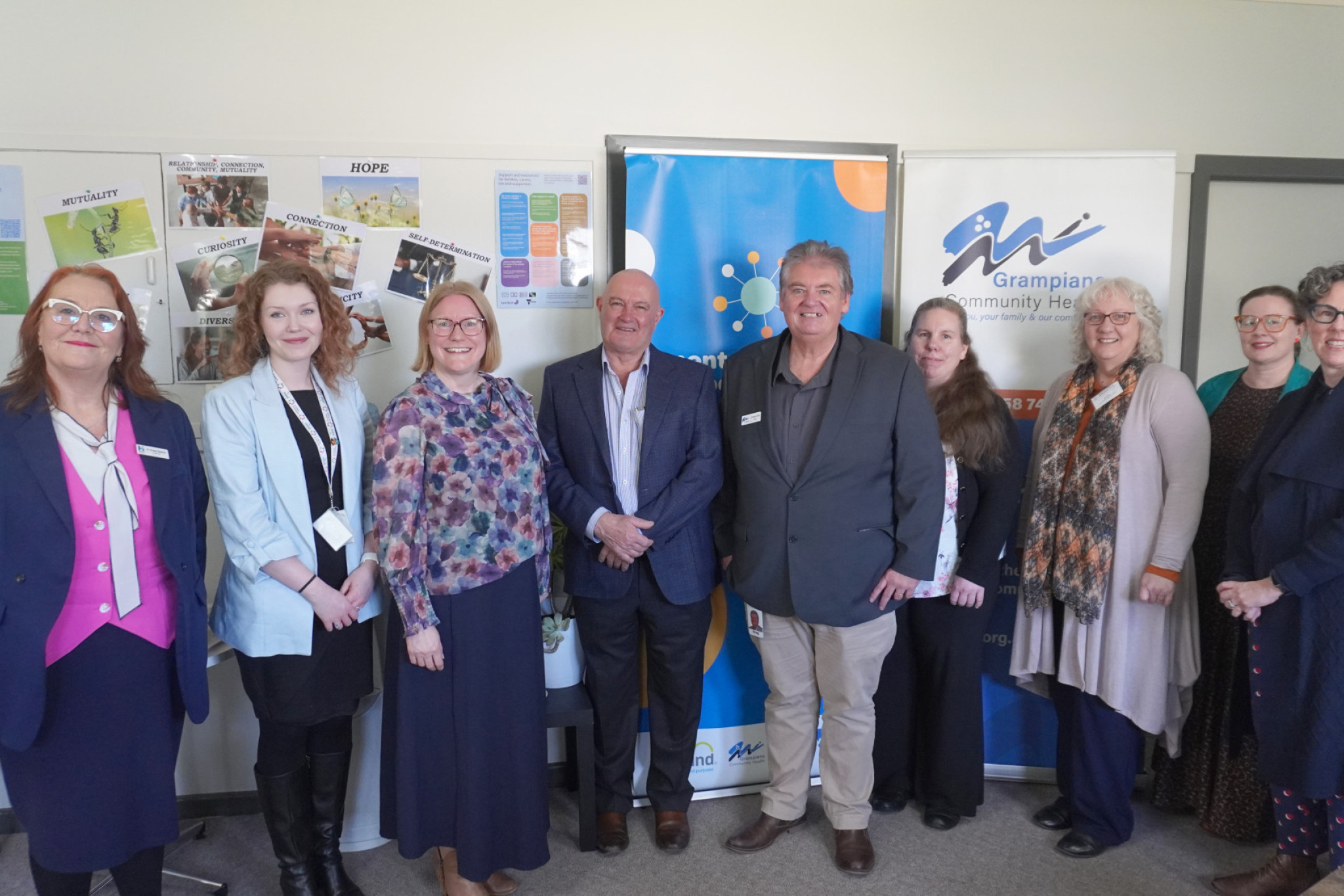 Hindmarsh Shire Council's Cr Rosie Barker, Emily McGuire (Mind Australia), Carolynne White (Mind Australia), mayor Ron Ismay, Grampians Community Health chief executive Greg Little, Rael Cartledge (Mind Australia), Del Taite (GCH), Faith Hardman (GCH), and Belinda McCullough (Mind Australia) at the Grampians Mental Health and Wellbeing Connect Centre opening.