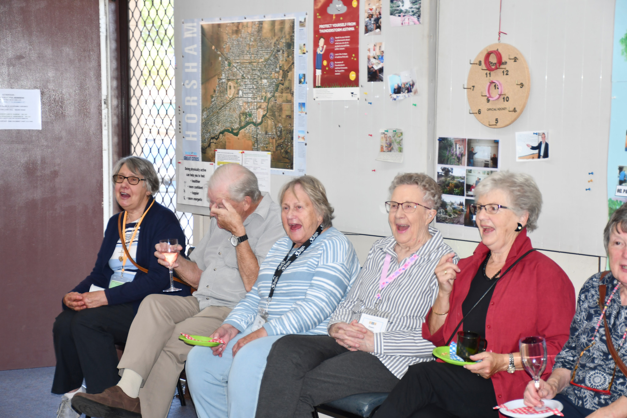 U3A members catch a fit of the giggles at their anniversary bash.