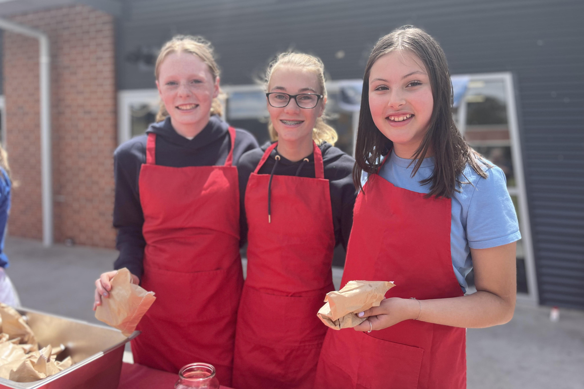 Donut sellers Lucy Clark, Lacy Perry and Asha Meek. Photo: EMILY FRIEDRICHSEN