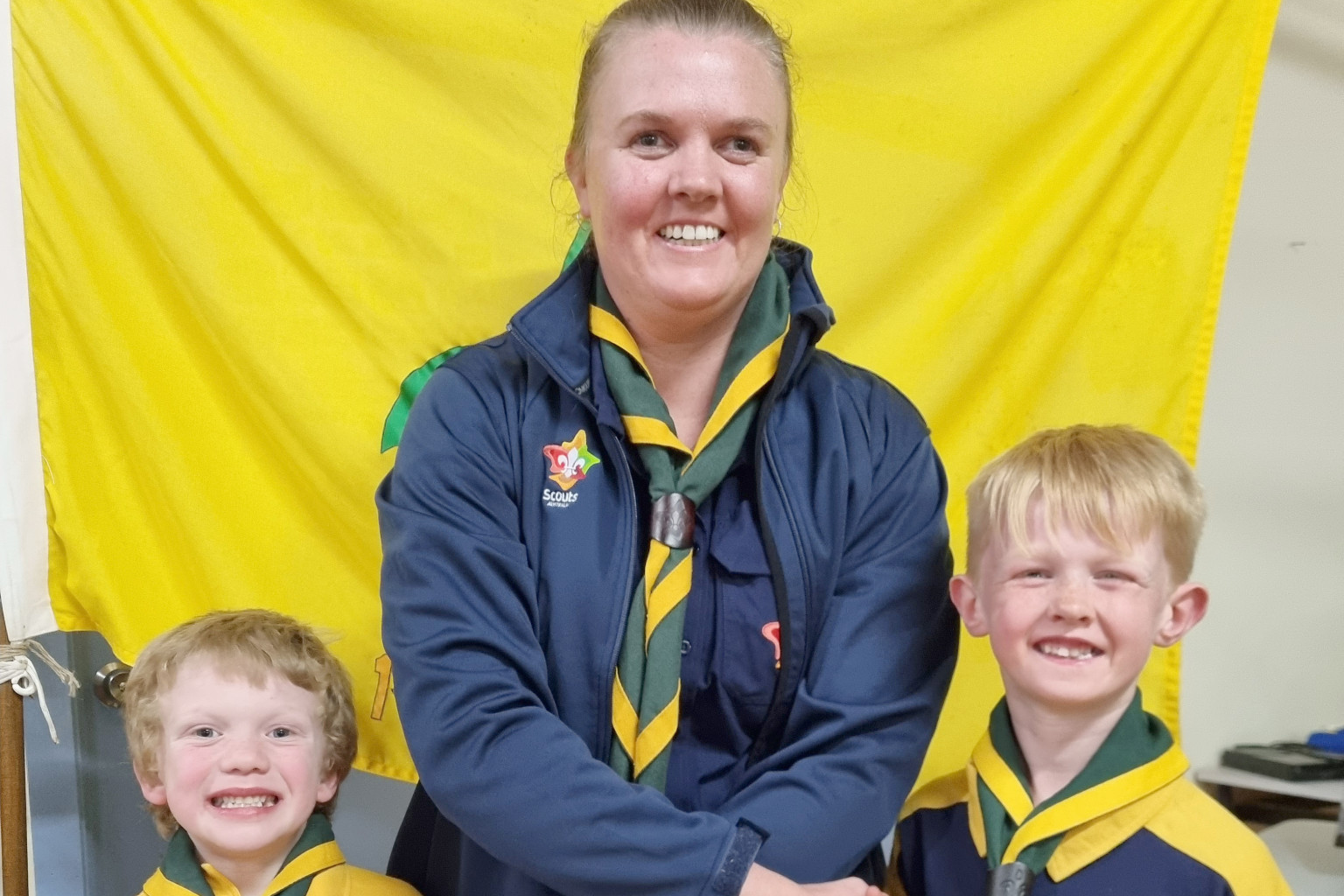 New Cubs' leader Jess Hollamby welcomes Hayden Clugston and Xavier Hollamby to the 1st Rainbow Unit.