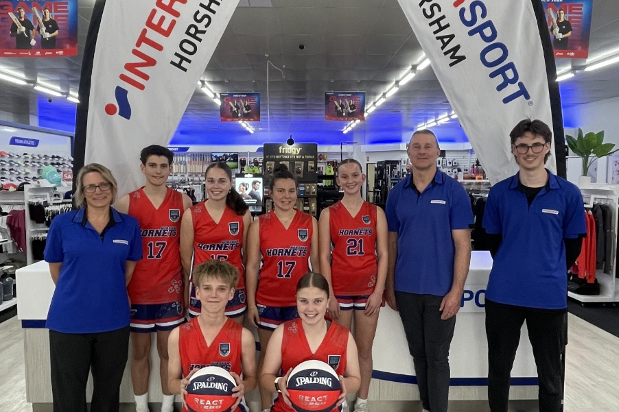 Junior Horsham Hornets players with staff from Intersport Horsham ahead of the Intersport Horsham Junior Classic Basketball Tournament.