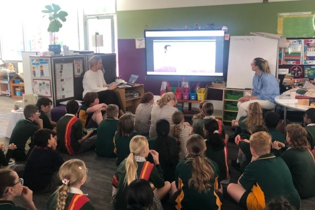 Dozens of Ss Michael and John's Primary School students enjoy reading The Truck Cat during the National Simultaneous Storytime.
