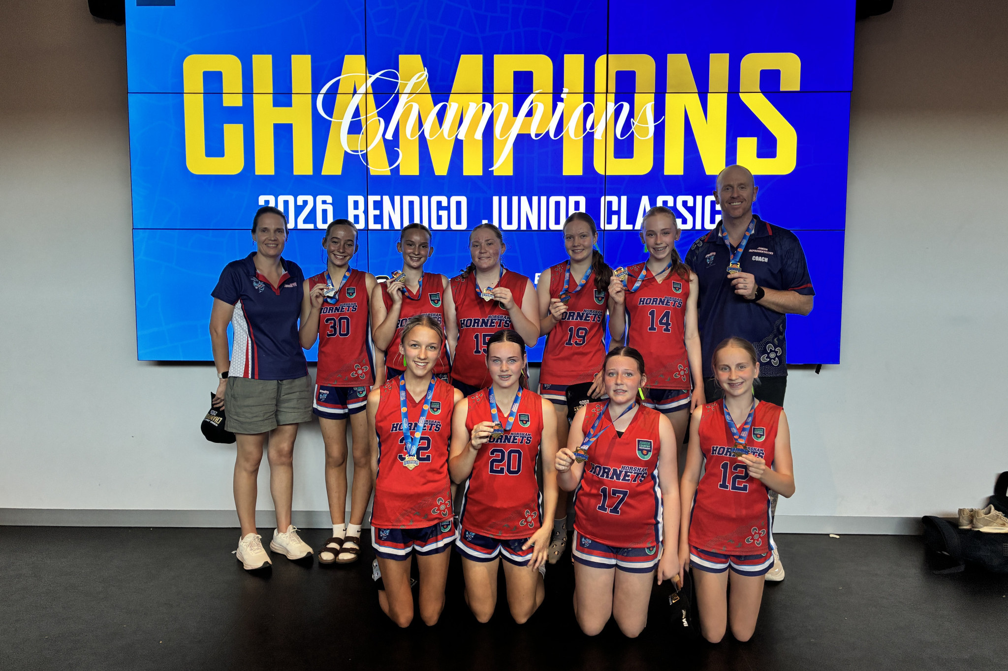 The successful under 16s girls Horsham Hornets basketball team pose with the winning medals from the Breach Apparel Bendigo Junior Classic. The side defeated Ballarat 28-15 to win division two.