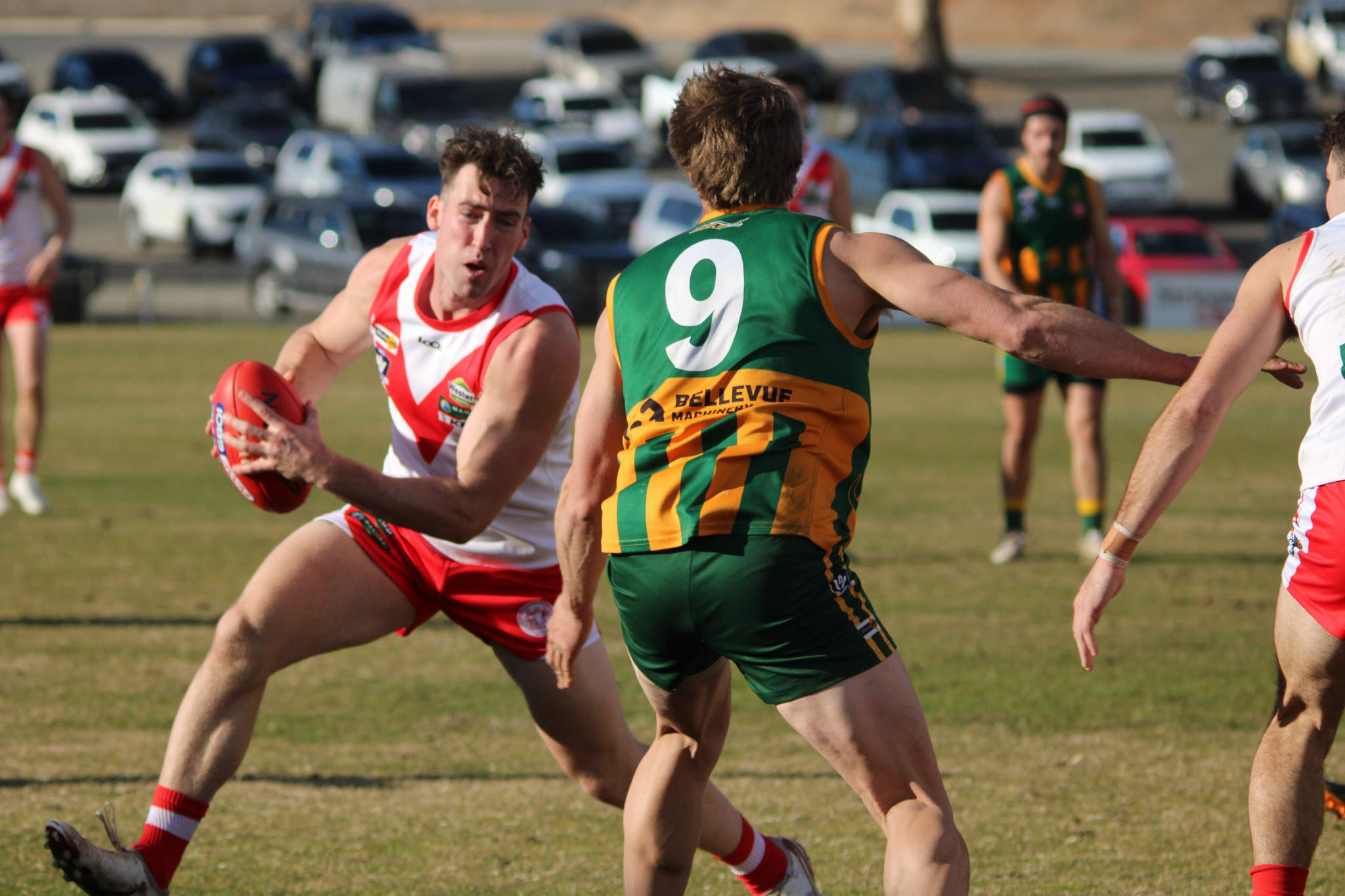 Ararat ace Tom Williamson tries to evade Dimboola's captain Ben Miller.