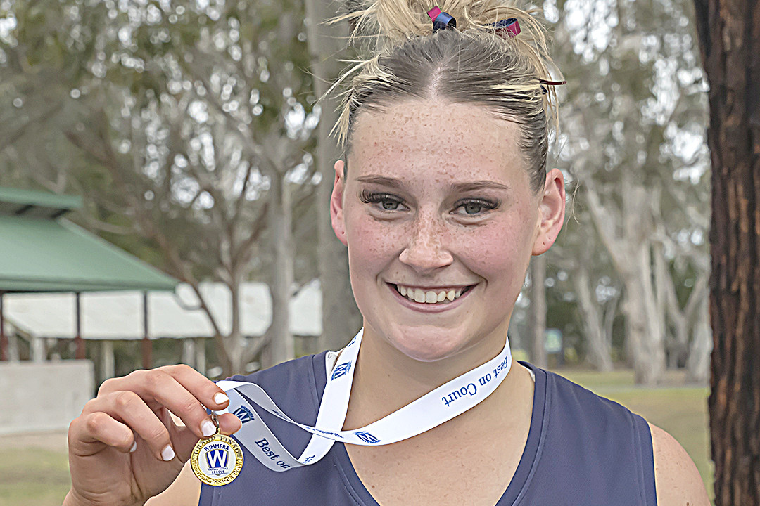 Imogen Worthy shows off her best on the court medal. PHOTO: SHANE ROBERTS