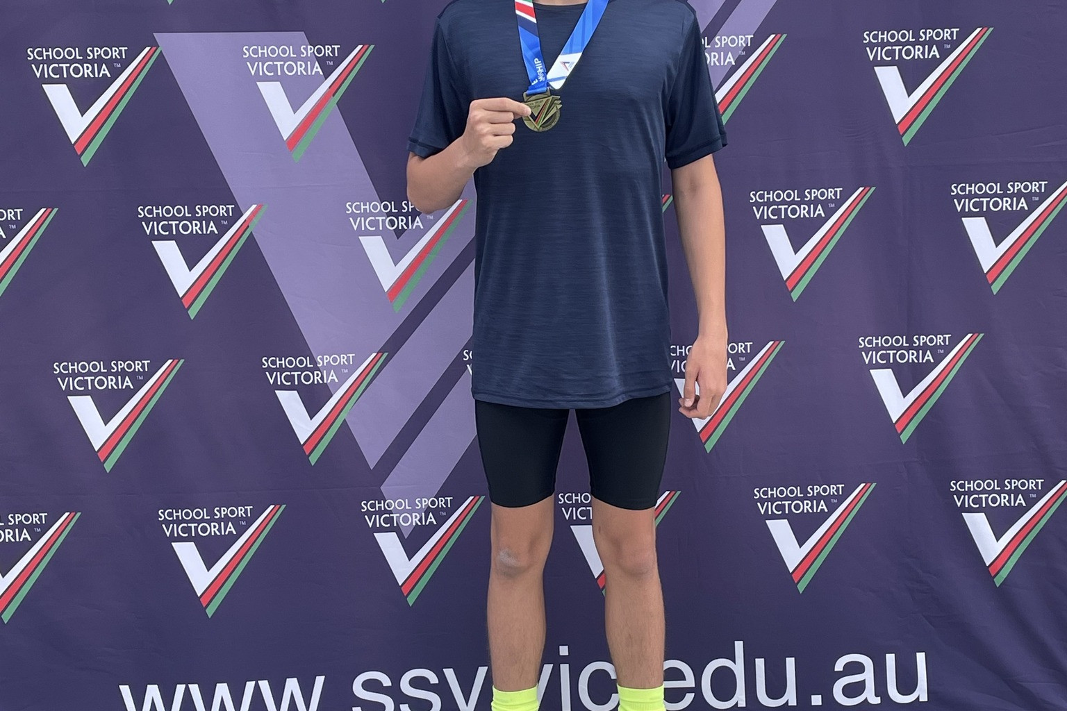 Jett Hill with his gold medal after winning the School Sport Victoria under 13s 400m at the state track and field championships.