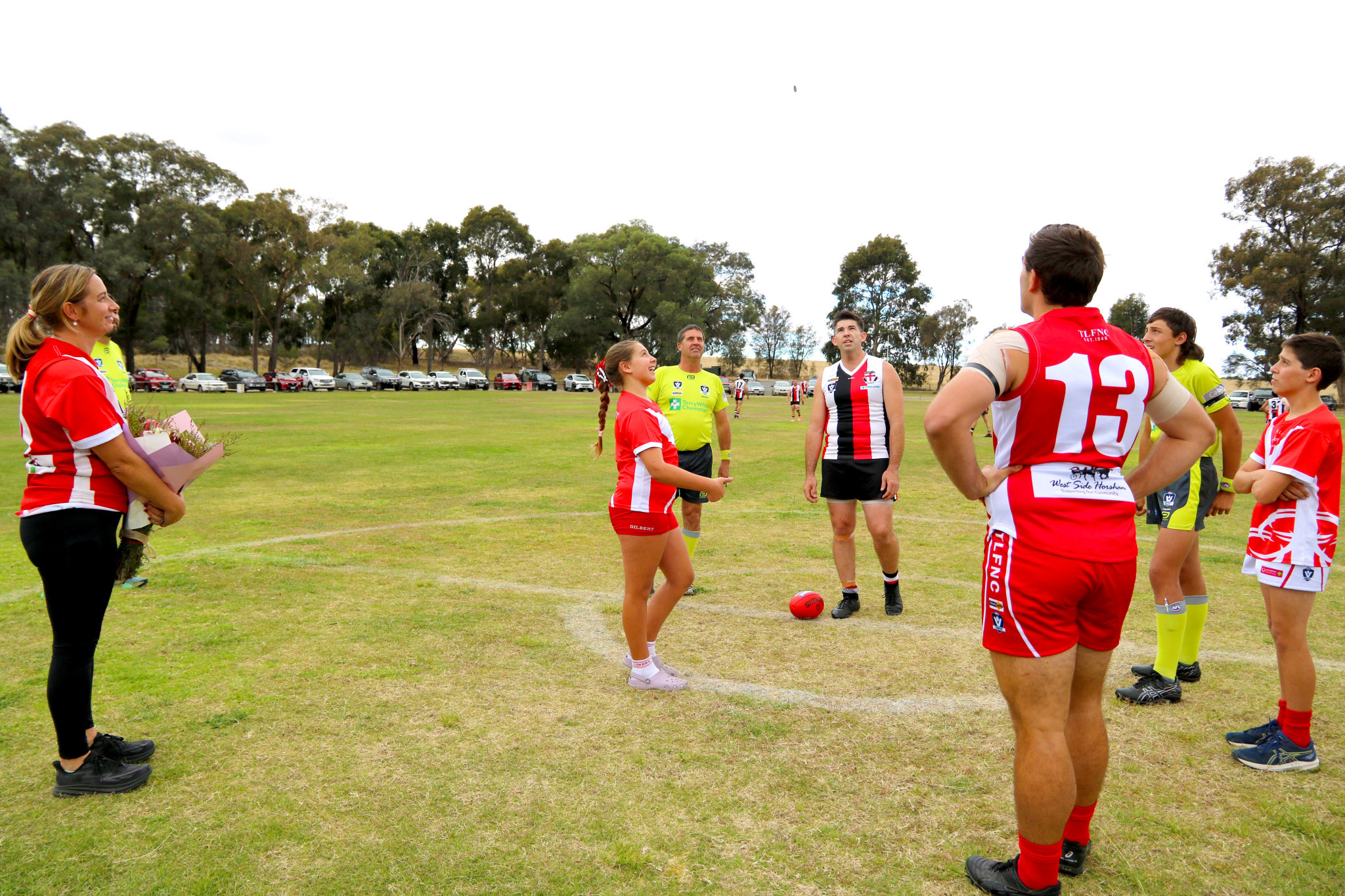 John 'JK' Kelly's daughter Charlotte tossed the coin before the senior match with his son, Jack, and wife, Kristy present.