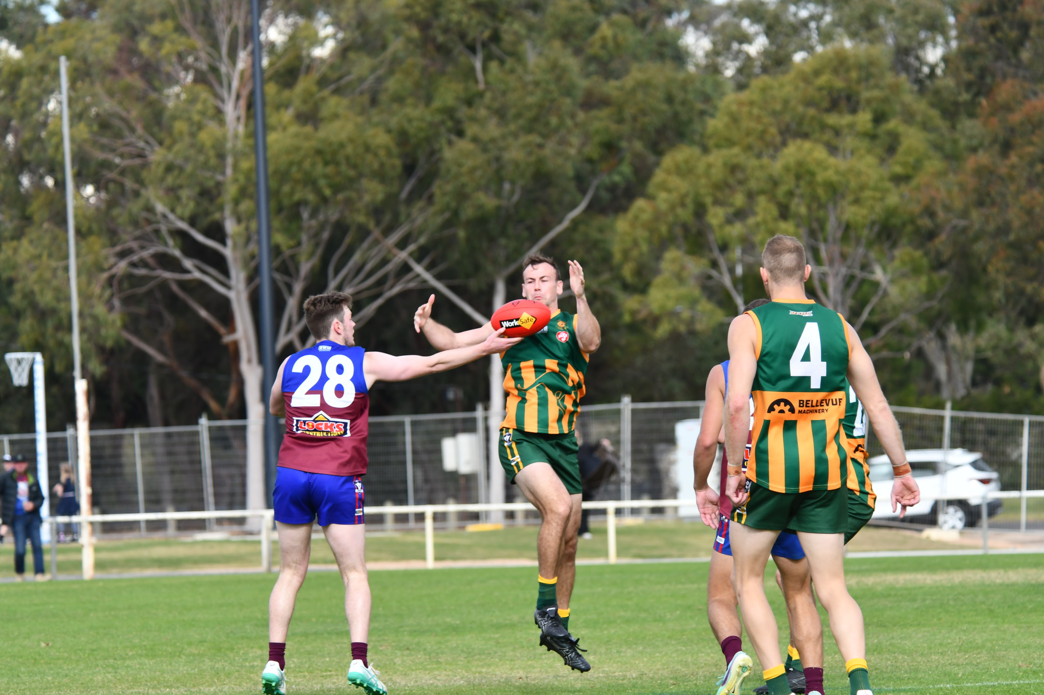 Demons' Matthew Long tries to get possession. PHOTO: TONY TOMLINS