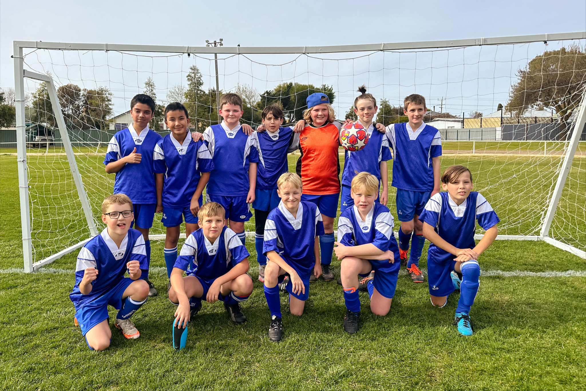 The under-12s gather for a photo following their win. PHOTO: KATELYN TEPPER