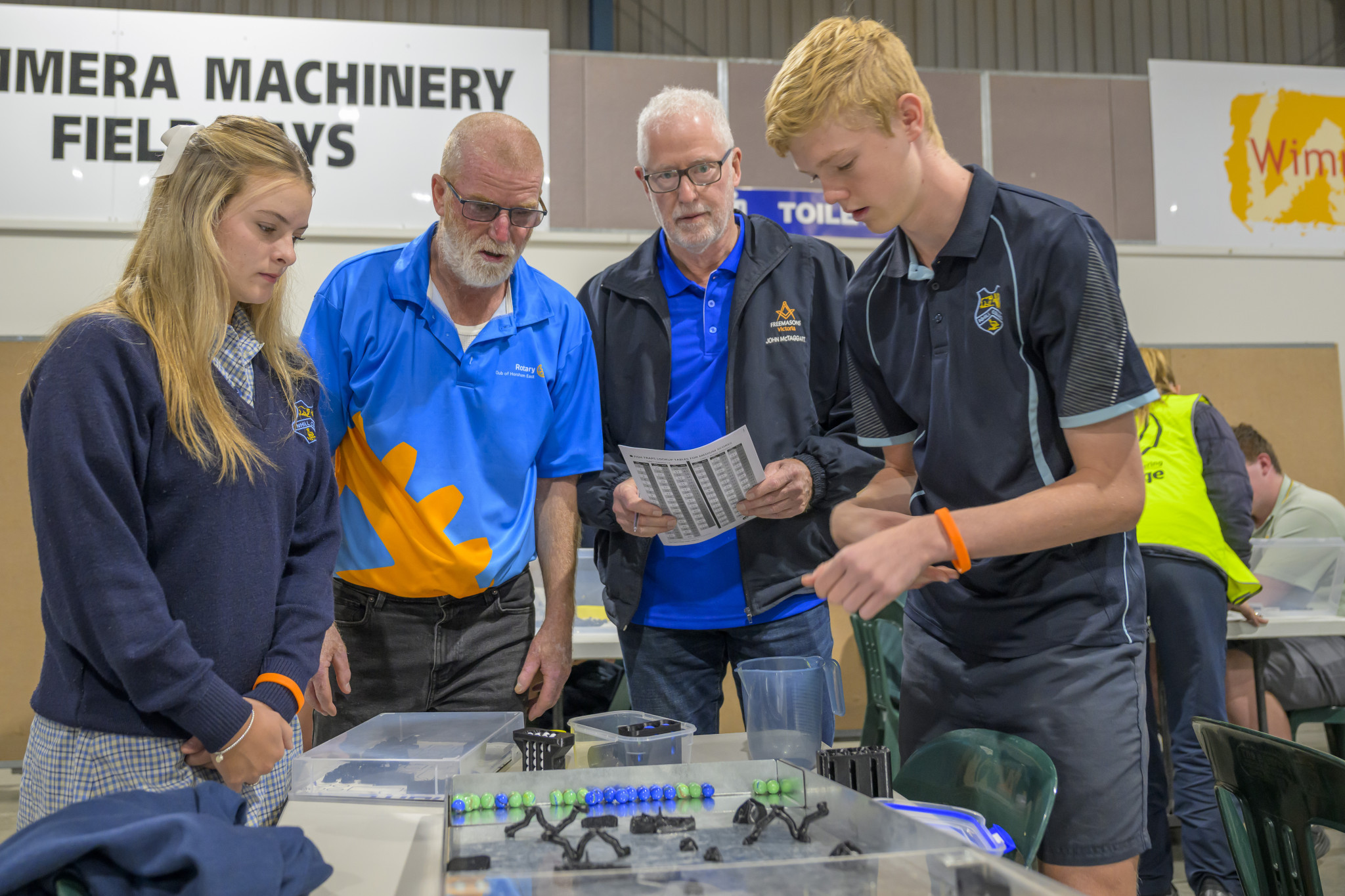 Maddi Lowe from Nhill College, Tom Gallagher (organiser from the Rotary Club of Horsham East), John McTaggart (helper), Rily Phillip also from Nhill College doing the Fish trap challenge. Photo: ROBIN WEBB