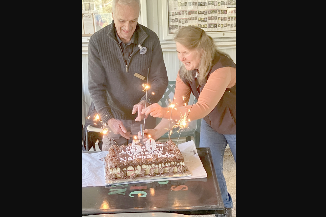 Former Director of the National Parks Service (1979- 1994) Don Saunders and Victorian Protected Areas Council president Felicity Brooke cut the cake during the celebration.