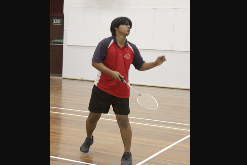 Tim McIntosh unleashes a serve.