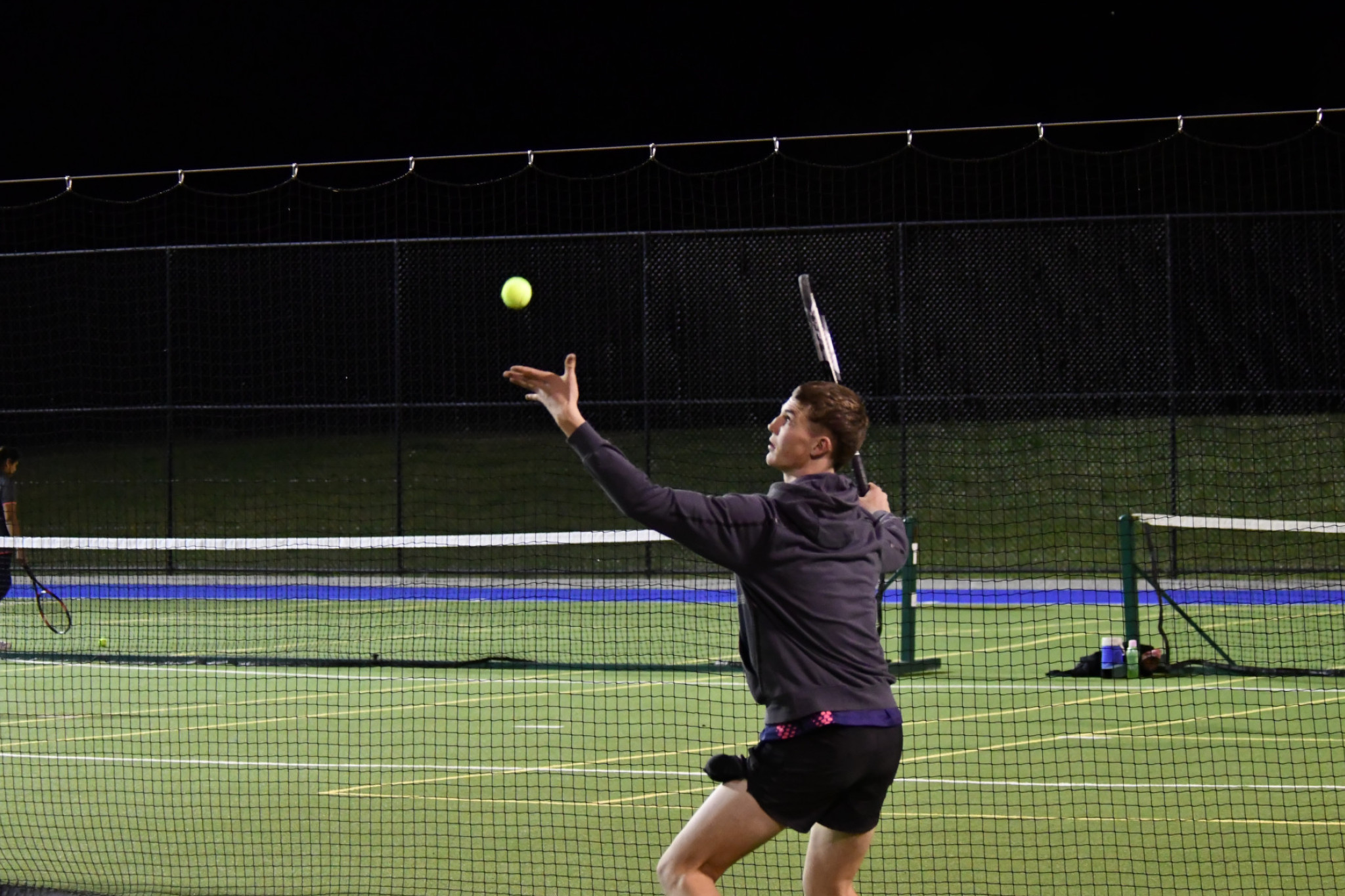 Brim's Seth Keam starts his serving action.