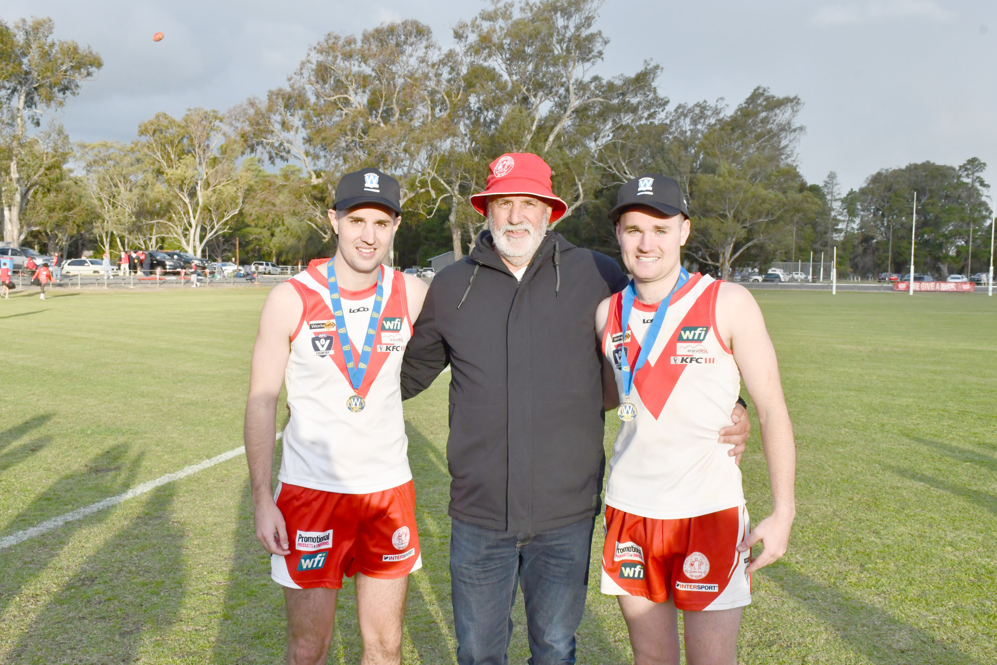 Luke and Matthew Spalding with their father, Mick, who played in the 1986 premiership. PHOTO: CHRIS GRAETZ