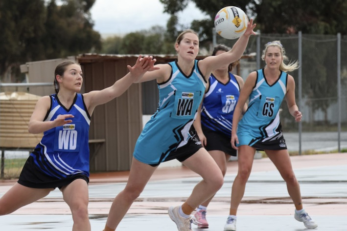 Southern Mallee Thunder's Codie Robins tries to take possession pressured by Minyip Murtoa's Hayley Campbell.