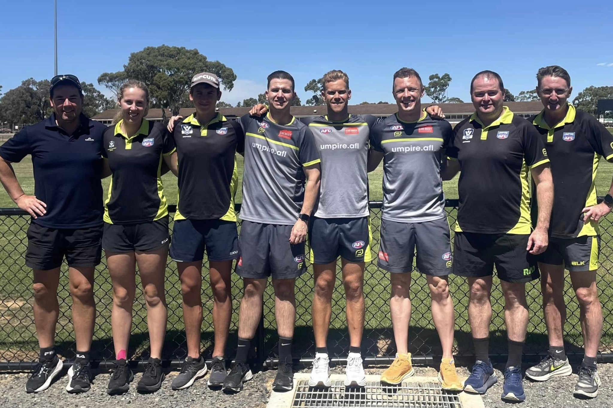 The umpires and coaches following the session.