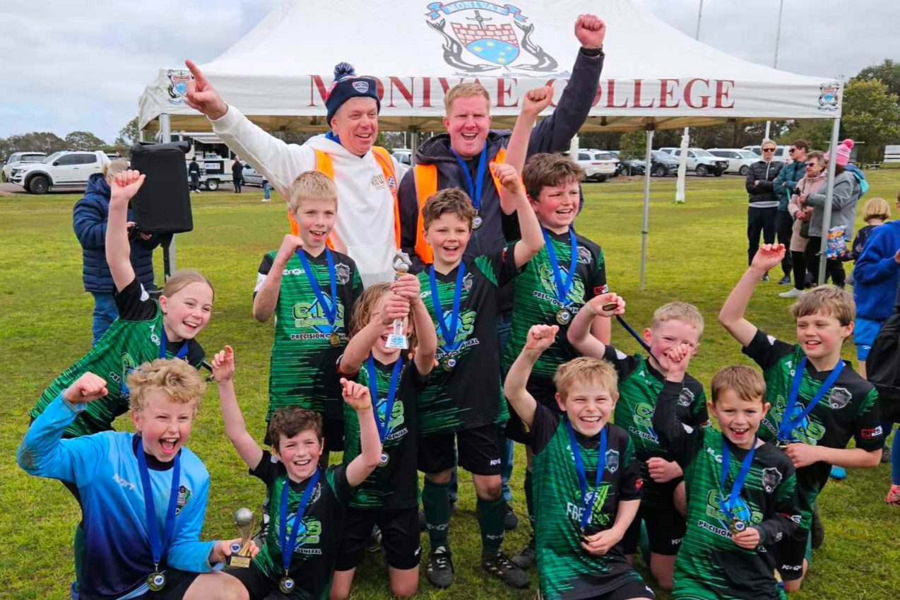 The under-10s celebrate. PHOTO: SUPPLIED