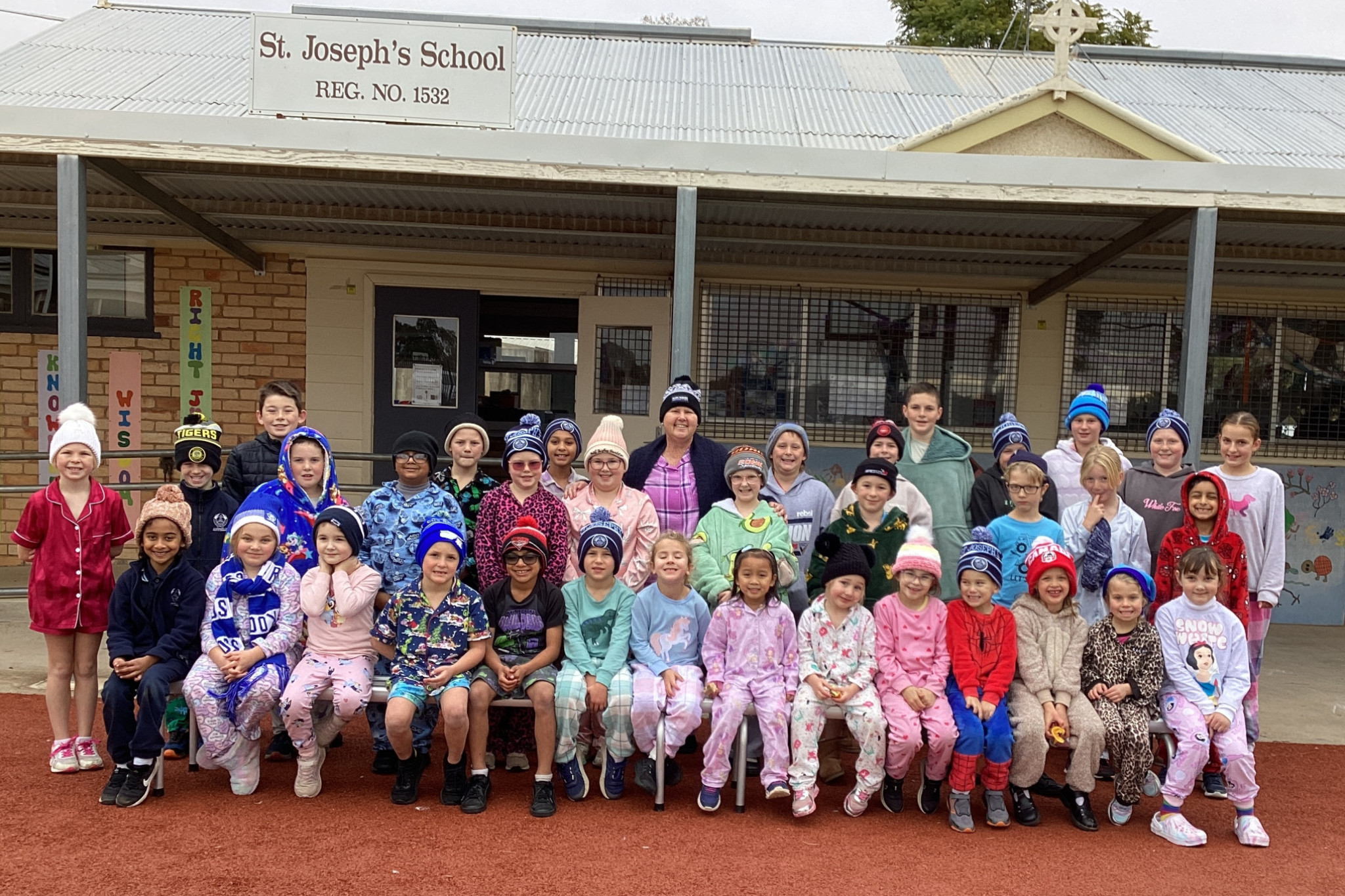 St Joseph Primary School kids with principal Cynthia Maiden in the middle on PJ and Beanies Day last Friday, June 27.