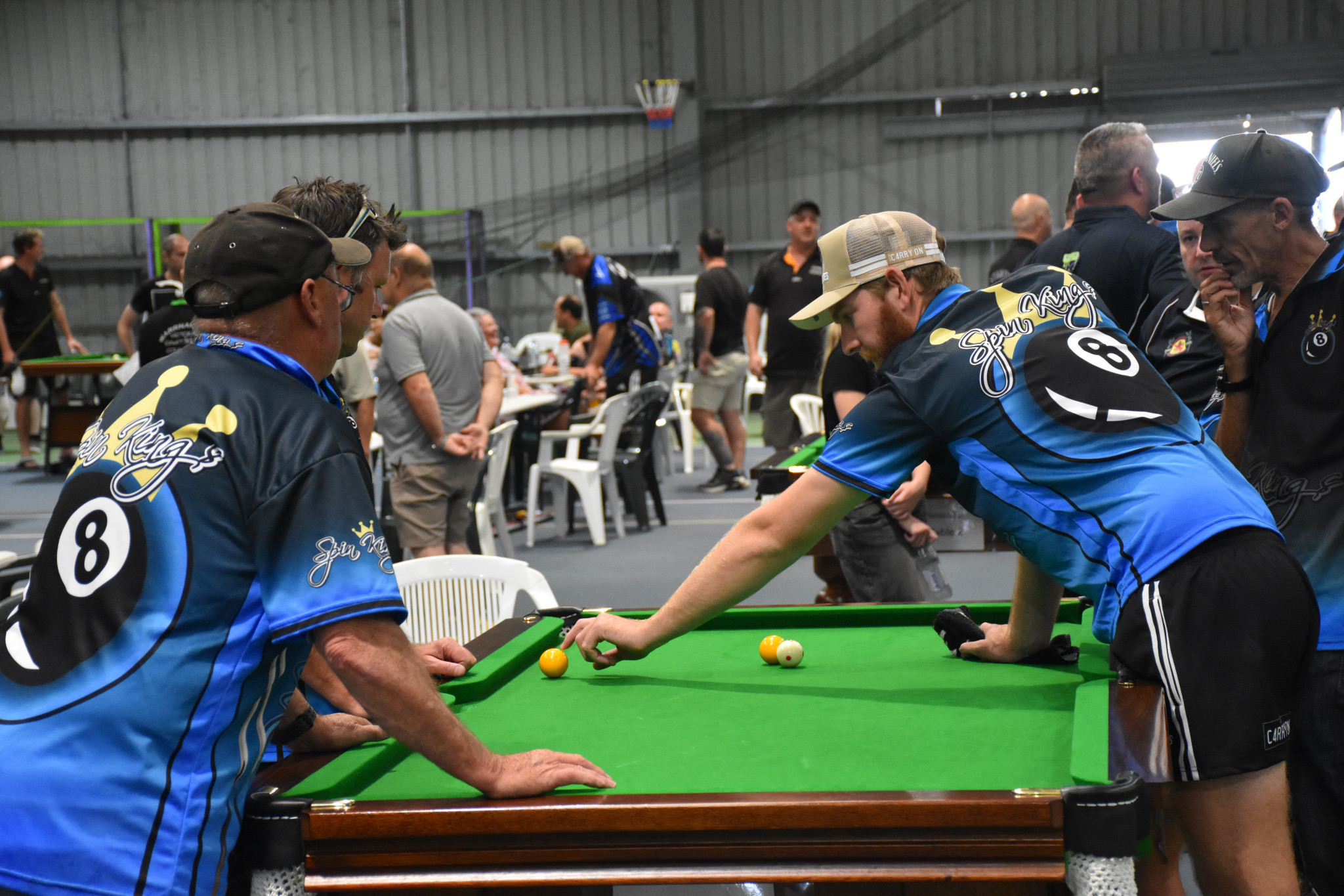 Team Spin Kings talk strategy. PHOTO: CHRIS GRAETZ