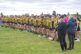 Pimpinio line up for a minutes silence.